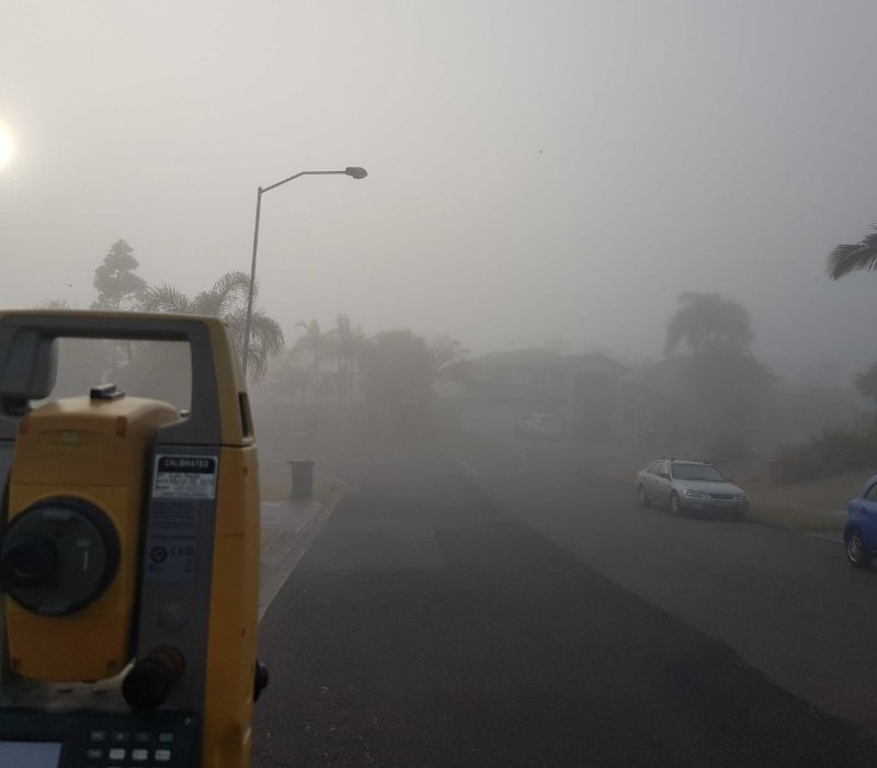 Surveying on a foggy day.