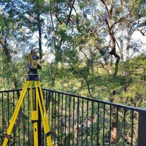 Surveying property from a balcony.